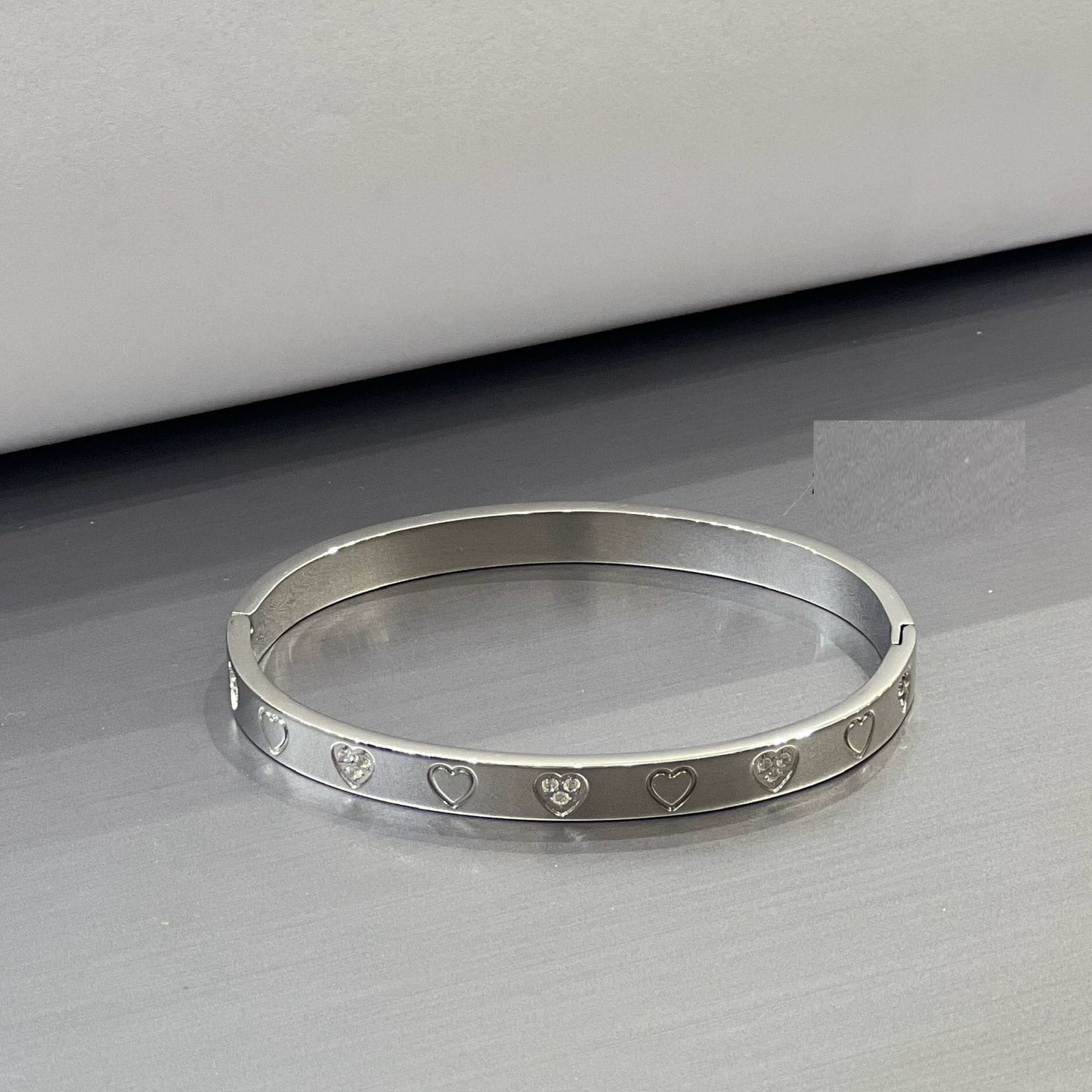 Heart Engraved Silver Bangle - Zambeel
