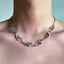 Irregular Shaped Metal Necklace On The Street - Zambeel