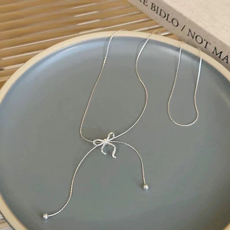 Long Bow Tie Tassel Pull Necklace For Women - Zambeel